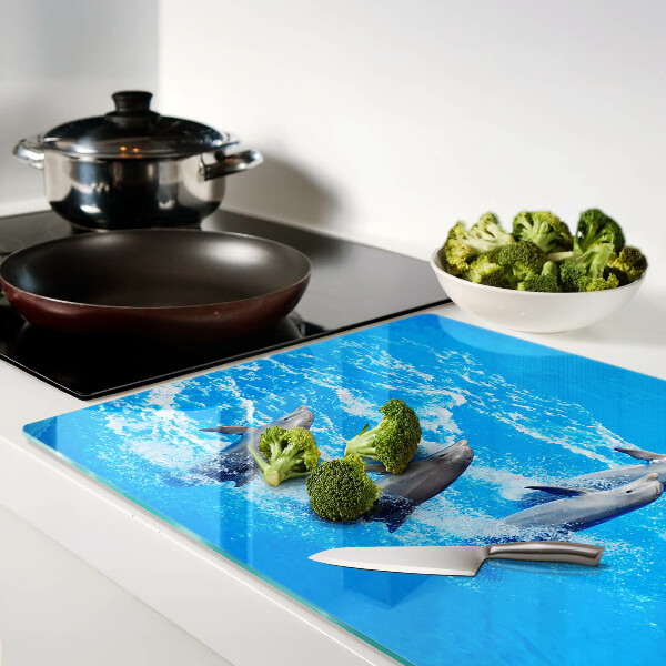 Tagliere in vetro con motivo di delfini che saltano tra le onde