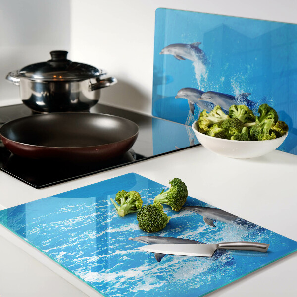 Tagliere in vetro con motivo di delfini che saltano tra le onde