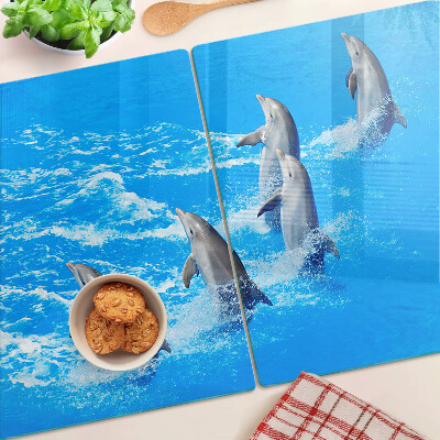 Tagliere in vetro con motivo di delfini che saltano tra le onde