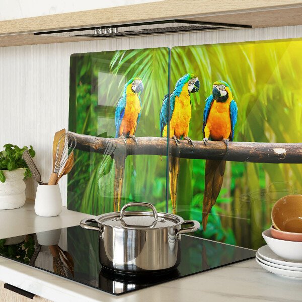 Tagliere in vetro temperato con stampa di pappagalli su un ramo in stile tropicale