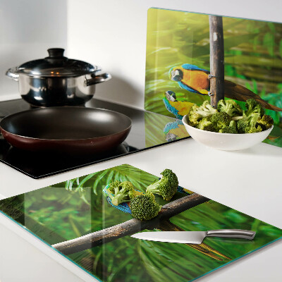 Tagliere in vetro temperato con stampa di pappagalli su un ramo in stile tropicale