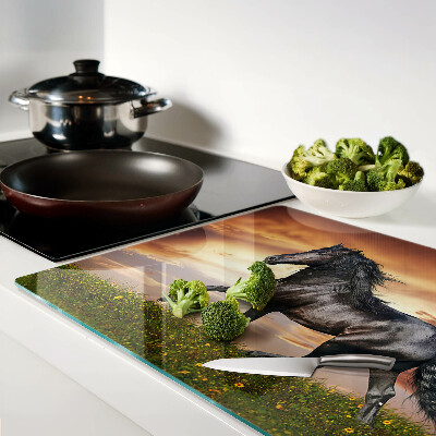 Tagliere in vetro temperato con stampa di un cavallo davanti al sole al tramonto