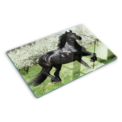 Tagliere in vetro temperato con stampa di un cavallo nero sul prato
