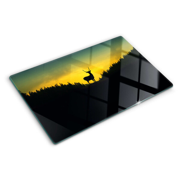 Tagliere in vetro temperato con disegno di un cervo su sfondo di sole al tramonto