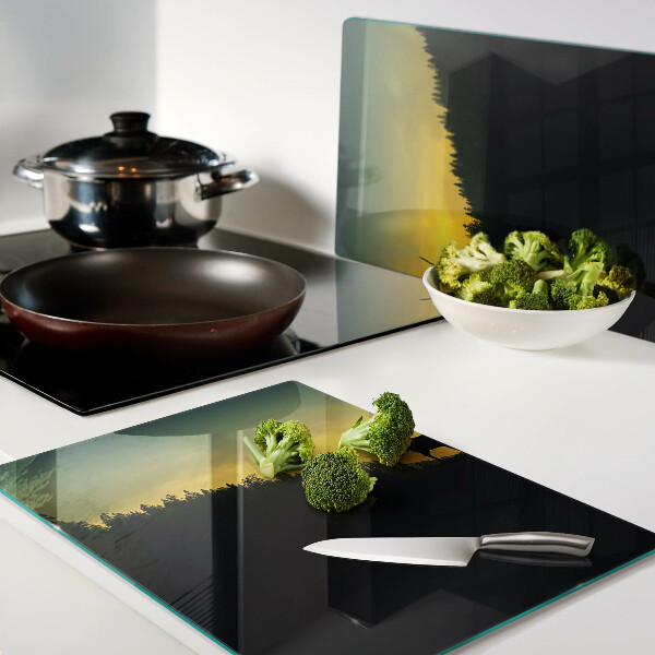 Tagliere in vetro temperato con disegno di un cervo su sfondo di sole al tramonto