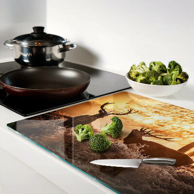 Tagliere in vetro temperato con stampa raffigurante cervi nel bosco al tramonto