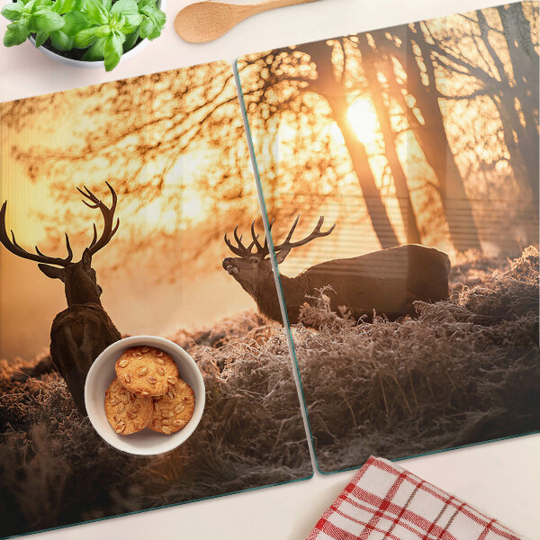 Tagliere in vetro temperato con stampa raffigurante cervi nel bosco al tramonto