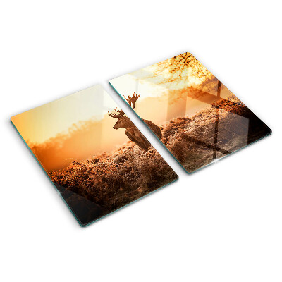 Tagliere in vetro con decorazione di un cervo sullo sfondo del tramonto