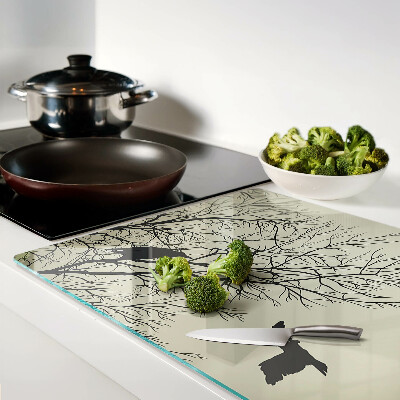 Tagliere in vetro con decorazione di uccelli sui rami degli alberi