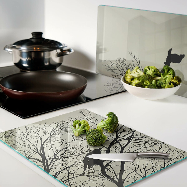 Tagliere in vetro con decorazione di uccelli sui rami degli alberi