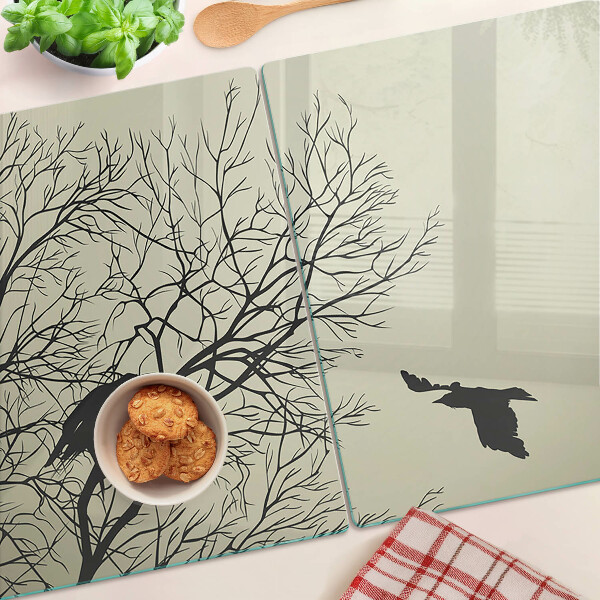 Tagliere in vetro con decorazione di uccelli sui rami degli alberi