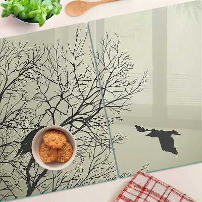 Tagliere in vetro con decorazione di uccelli sui rami degli alberi