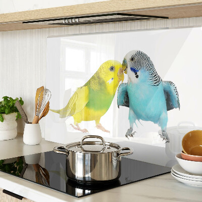 Tagliere in vetro temperato con decorazione di pappagalli nei toni del giallo e del blu