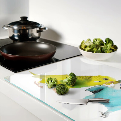 Tagliere in vetro temperato con decorazione di pappagalli nei toni del giallo e del blu