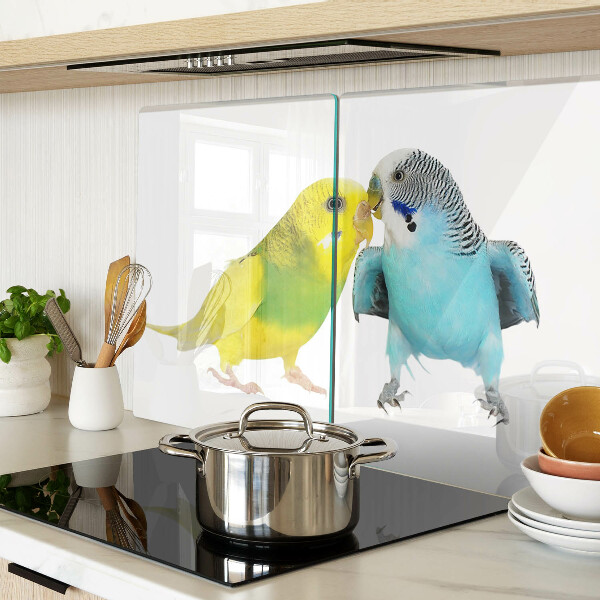 Tagliere in vetro temperato con decorazione di pappagalli nei toni del giallo e del blu