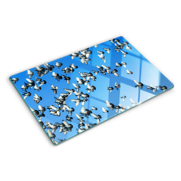 Tagliere in vetro temperato con decorazione di piccioni in volo nel cielo