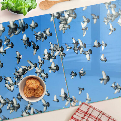 Tagliere in vetro temperato con decorazione di piccioni in volo nel cielo