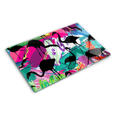 Tagliere in vetro con decorazione di fenicotteri su sfondo colorato