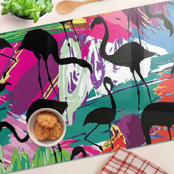 Tagliere in vetro con decorazione di fenicotteri su sfondo colorato