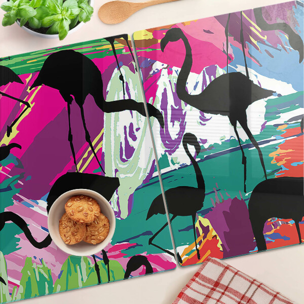 Tagliere in vetro con decorazione di fenicotteri su sfondo colorato