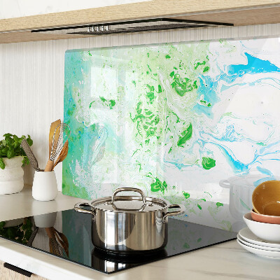 Tagliere in vetro con motivo a vortici astratti nei toni del verde e del blu