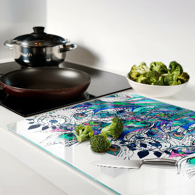 Tagliere in vetro temperato con motivo di piume di pavone nei toni del verde e del blu