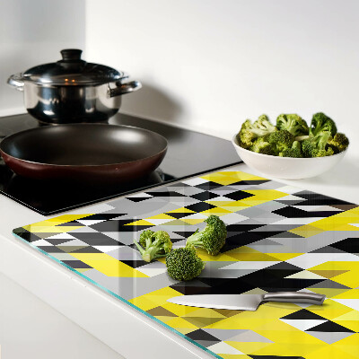 Tagliere in vetro con motivo geometrico nei toni del giallo e del nero