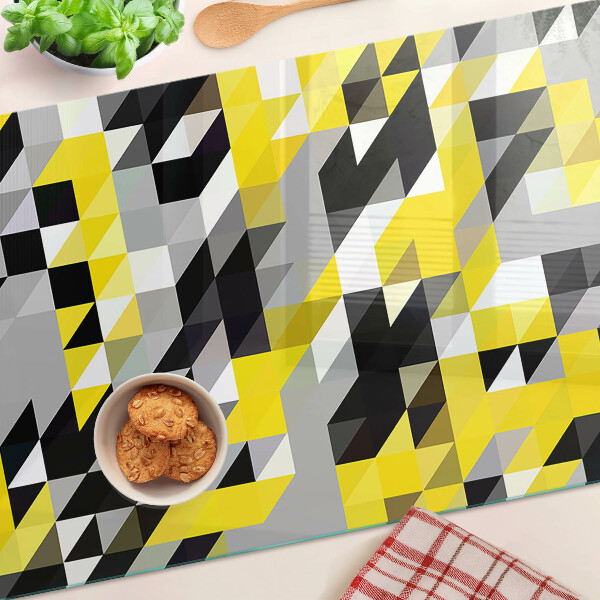 Tagliere in vetro con motivo geometrico nei toni del giallo e del nero