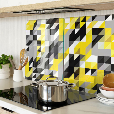 Tagliere in vetro con motivo geometrico nei toni del giallo e del nero