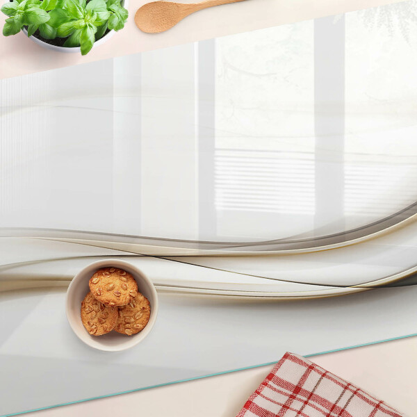 Tagliere in vetro temperato con motivo a onde astratte nei toni del beige