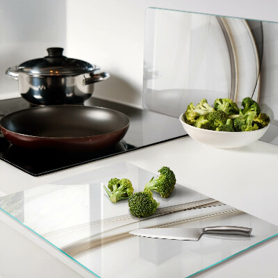 Tagliere in vetro temperato con motivo a onde astratte nei toni del beige