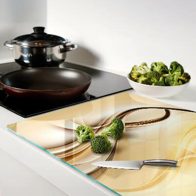 Tagliere in vetro con stampa a onde astratte nei toni del beige