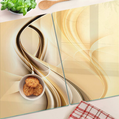 Tagliere in vetro con stampa a onde astratte nei toni del beige