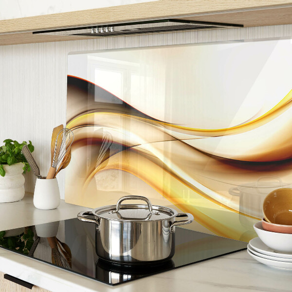 Tagliere in vetro temperato con motivo di onde astratte nei toni dell'oro