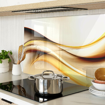 Tagliere in vetro temperato con motivo di onde astratte nei toni dell'oro