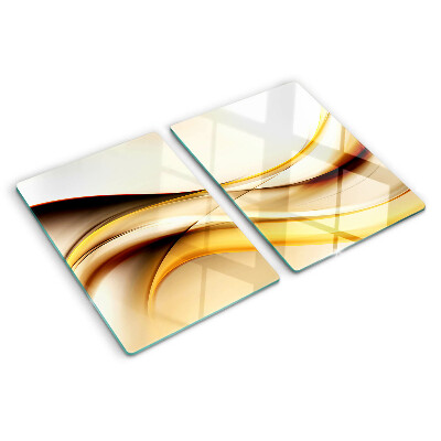 Tagliere in vetro temperato con motivo di onde astratte nei toni dell'oro
