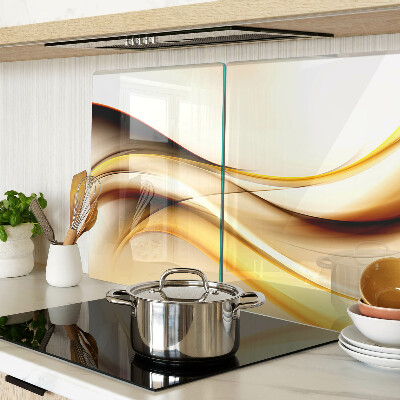 Tagliere in vetro temperato con motivo di onde astratte nei toni dell'oro