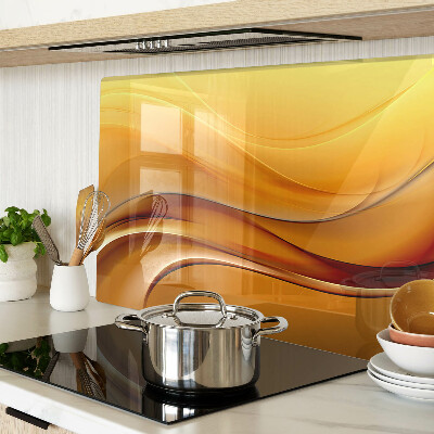 Tagliere in vetro con motivo a onde nei toni dell'oro