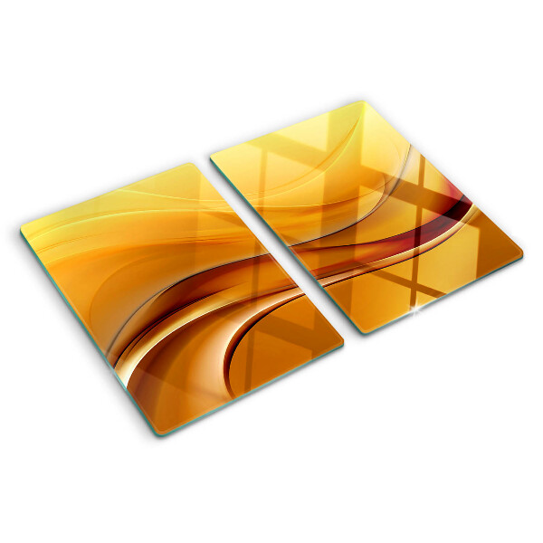 Tagliere in vetro con motivo a onde nei toni dell'oro