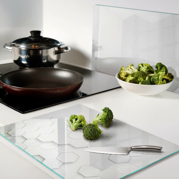 Tagliere in vetro temperato con motivo a esagoni nei toni del grigio