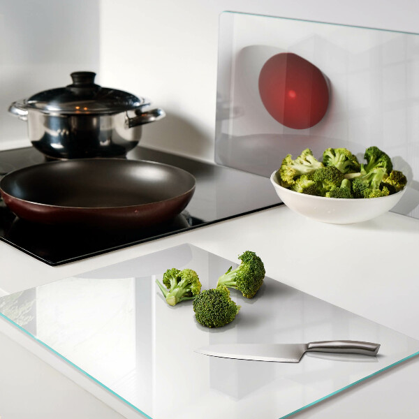 Tagliere in vetro con motivo a cerchio rosso su sfondo trasparente