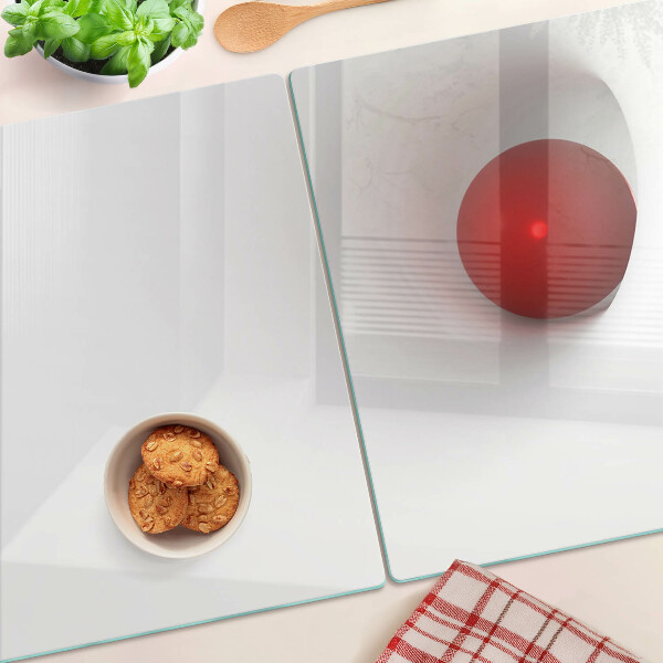 Tagliere in vetro con motivo a cerchio rosso su sfondo trasparente