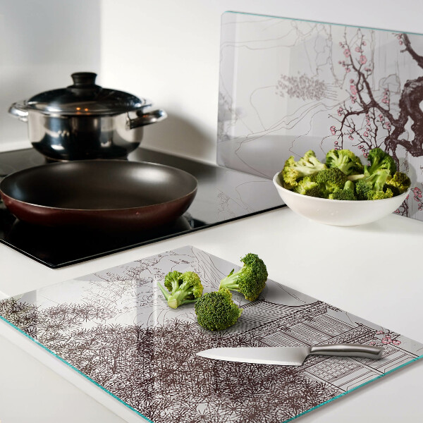 Tagliere in vetro temperato con paesaggio montano e alberi in fiore