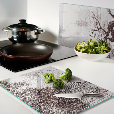 Tagliere in vetro temperato con paesaggio montano e alberi in fiore