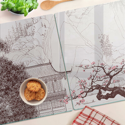 Tagliere in vetro temperato con paesaggio montano e alberi in fiore