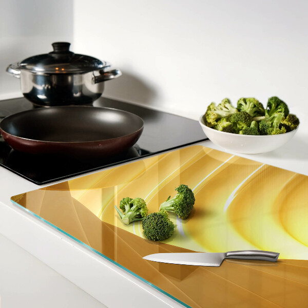 Tagliere in vetro con motivo di onde dorate e finiture a forma di finestre