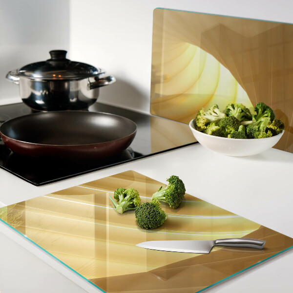 Tagliere in vetro con motivo di onde dorate e finiture a forma di finestre