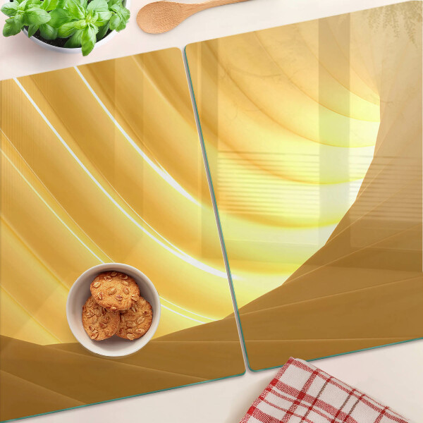 Tagliere in vetro con motivo di onde dorate e finiture a forma di finestre