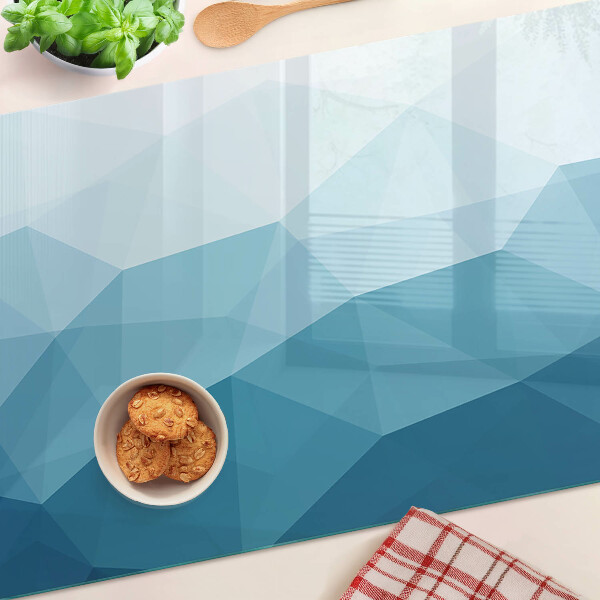 Tagliere in vetro con motivo a gradiente di triangoli blu