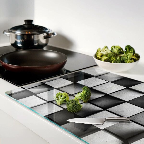 Tagliere in vetro con motivi geometrici nei toni del grigio